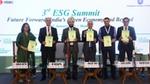 Mr B. P. Biddappa at the launch of Centre for Sustainability Leadership in partnership with Hindustan Unilever and FICCI. The picture includes a group of people holding a rectangular book.