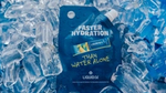 Liquid IV hydration packet surrounded by ice, promoting faster hydration than water alone. Blue and vibrant packaging on ice background.